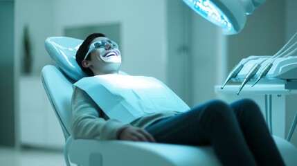 Poster - A patient relaxes in a dental chair while receiving laser treatment for oral care. The clinic features bright lighting and a calm environment, enhancing comfort during the procedure.
