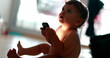 © Marco - Toddler baby using cellphone device