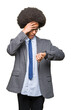 © Krakenimages.com - Young african american business man with afro hair wearing glasses Looking at the watch time worried, afraid of getting late