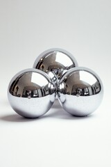 Wall Mural - Metal balls on white surface