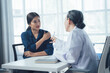 © Wicitr - Doctor Patient Consultation: A concerned young woman sits across from her doctor, attentively listening during a consultation. The image exudes empathy and trust.