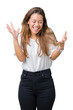 © Krakenimages.com - Young beautiful brunette business woman over isolated background celebrating mad and crazy for success with arms raised and closed eyes screaming excited. Winner concept