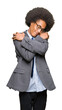 © Krakenimages.com - Young african american business man with afro hair wearing glasses Hugging oneself happy and positive, smiling confident. Self love and self care
