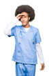 © Krakenimages.com - Young african american doctor man with afro hair very happy and smiling looking far away with hand over head. Searching concept.
