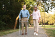 © New Africa - Senior couple with walking frame in park