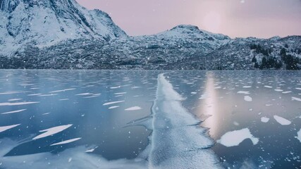 Wall Mural - aerial view from low flying drone of frozen lake in snowfall. mountains in winter at sunrise. lofote