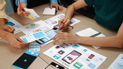Wall Mural - panorama video of startup company employee planning on user interface prototype for mobile applicati