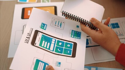 Wall Mural - panorama video of startup company employee planning on user interface prototype for mobile applicati