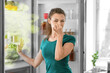 © Pixel-Shot - Young woman feeling bad smell from refrigerator in kitchen