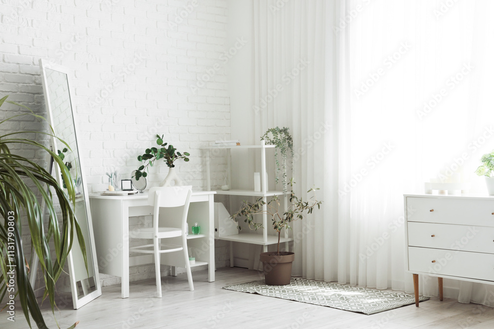 Interior of dressing room with makeup table, shelf unit and plants