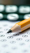 © Wonderful Studio - Tax submit finance concept. Close-up of a sharpened pencil on an answer sheet with numbered circles.