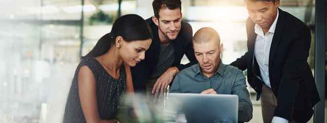 Wall Mural - Man, laptop and group in office with discussion, review and strategy for problem solving with diversity. Leader, staff and project management for risk analysis, team and reading at insurance agency