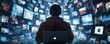 © SUKHUM - Guy in a hoody using a laptop, surrounded by virtual video shots on a digital background, symbolizing the future of content creation and online media