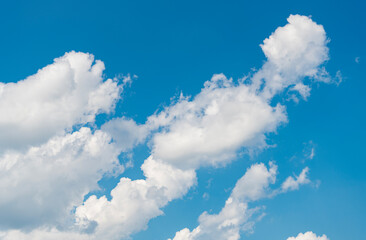 Wall Mural - Blue sky with clouds in the sky. Beautiful blue sky background with clouds.Natural and cloudy fresh blue sky background. White fluffy clouds in the blue sky.