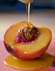 Wall Mural - Sweet honey drizzled over a juicy peach half.