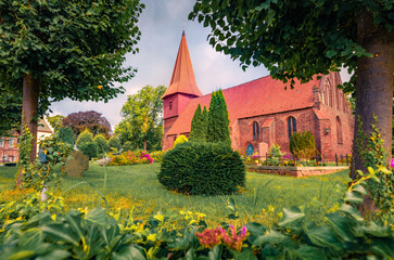 Wall Mural - summer view of red bricks st. nikolai evangelical church. nice morning cityscape of altefahr village