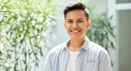 Confident young asian adult smiling in bright natural setting for diversity and positivity themes