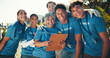 © peopleimages.com - Portrait, happy and group with clipboard, volunteers and joy for collaboration, charity and fundraiser. Outdoor, hug and mature woman with team, smile and good news for community service and USA