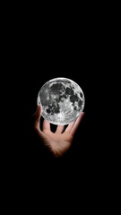 Wall Mural - Hand Holding a Detailed Moon Globe in the Dark