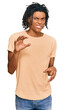 © Krakenimages.com - Young african american man wearing casual clothes disgusted expression, displeased and fearful doing disgust face because aversion reaction. with hands raised