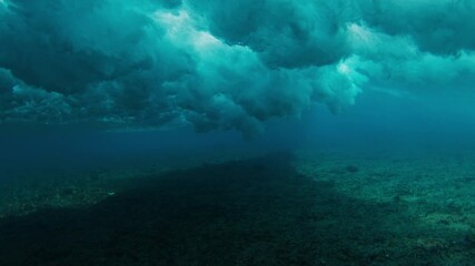 Aufkleber - Surfer is riding a wave with the scene from above and below the surface. Maldives