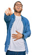 © Krakenimages.com - Young caucasian man wearing casual clothes laughing at you, pointing finger to the camera with hand over body, shame expression