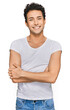© Krakenimages.com - Young handsome man wearing casual white t shirt happy face smiling with crossed arms looking at the camera. positive person.