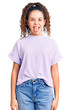© Krakenimages.com - Beautiful kid girl with curly hair wearing casual clothes sticking tongue out happy with funny expression. emotion concept.