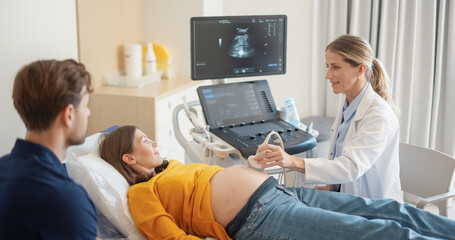 Aufkleber - Obstetrician Performing Ultrasound on Pregnant Woman while Partner Sitting Close By, Holding Her Hand and Watching at the Screen. Doctor Using Advanced Equipment to Examine Fetus on Computer Monitor