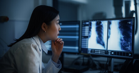 Aufkleber - Portrait of an Asian Female Radiologist Examines Chest X-rays on Multiple Monitors in a Dark Medical Office. Healthcare Professional Focused on Analyzing Detailed Medical Imagery of a Patient