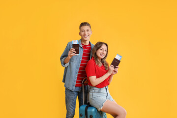 Sticker - Happy travellers with suitcase, passports and tickets on yellow background