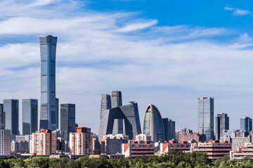 Wall Mural - High view scenery of Beijing CBD architectural complex against the backdrop of green trees in urban parks in Beijing, China