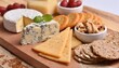 © arbi wiratama - Assortment of Artisanal Cheeses and Crackers on Wooden Board