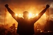 © c80 - Celebration of music at sunset with enthusiastic audience member raising arms in excitement during outdoor concert