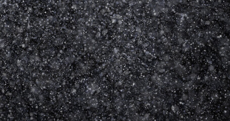 Wall Mural - Natural white winter snowfall on a black background 3d rendering