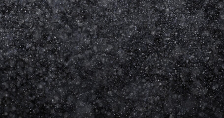 Wall Mural - Natural white winter snowfall on a black background 3d rendering