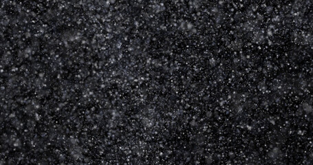 Wall Mural - Natural white winter snowfall on a black background 3d rendering