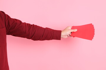 Wall Mural - hand holding Red envelopes