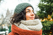 © romanets_v - Young hispanic female enjoying winter weather with warm knitted attire