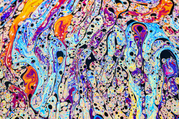 Wall Mural - Real photograph of a colorful light interference on a soap bubble surface with random swirls, curves and lines