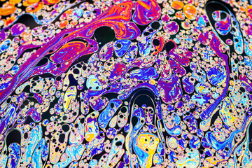 Wall Mural - Real photograph of a colorful light interference on a soap bubble surface with random swirls, curves and lines