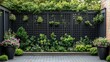 © azi - Black lattice fence with potted plants and lush greenery in a backyard patio setting.