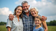 © Rick Captura - Grandparents and family smiling outdoors in a green landscape