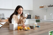 © Pixel-Shot - Ill young woman drinking hot tea in kitchen