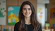 © Gabriela - Smiling Latina teacher, preschool classroom in background