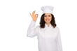 © PeopleVideos - Latina culinary artist wearing a chef’s uniform posing elegantly