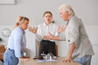 © Pixel-Shot - Angry mature couple visiting divorce lawyer in office