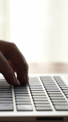 Wall Mural - businessman hand work on capable laptop computer at office table close up shot and selective focus a