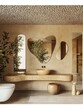 © Yelloone - A modern bathroom featuring natural materials, unique mirrors, and greenery, creating a serene and stylish atmosphere.