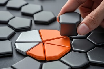 Poster - Hand placing hexagon piece onto a pie chart.
